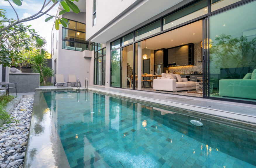 exterior home with swimming pool in the house