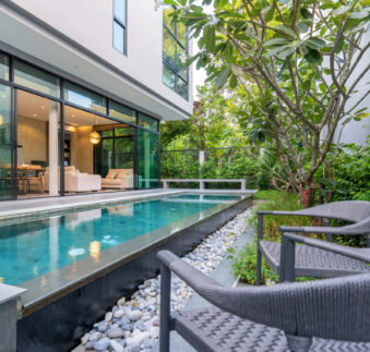 exterior home with swimming pool in the house