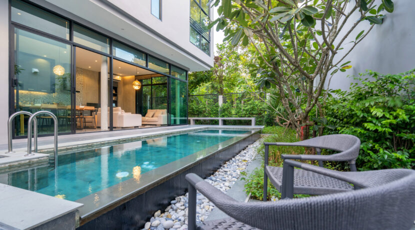 exterior home with swimming pool in the house